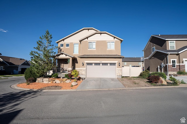 6561 S Evening Glow Ct W, West Jordan, UT 84081 - craftsman-style house featuring stucco siding, concrete driveway, an attached garage, and stone siding