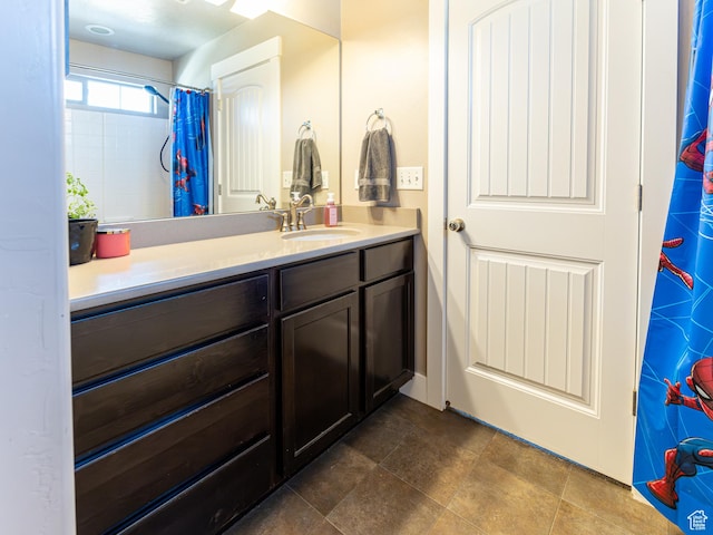 6561 S Evening Glow Ct W, West Jordan, UT 84081 - bathroom with vanity and a shower with curtain