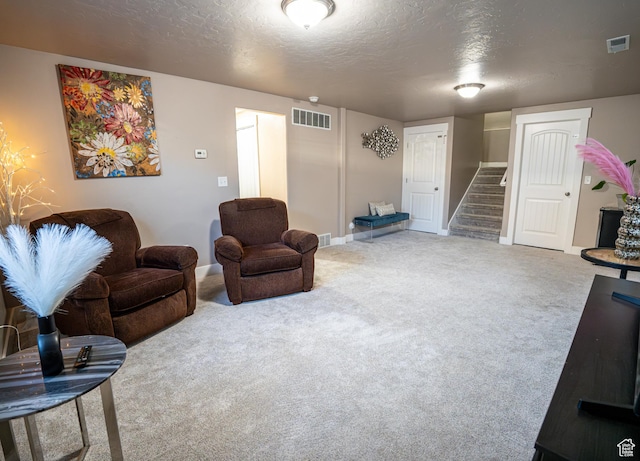 6561 S Evening Glow Ct W, West Jordan, UT 84081 - living area featuring stairway, a textured ceiling, and carpet flooring