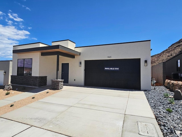 1465 S Staircase Way Unit 4065, Washington, UT 84780 - contemporary home with a garage, stucco siding, and driveway