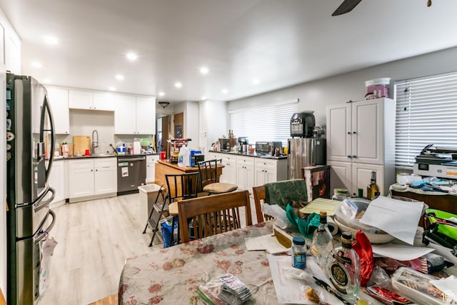 5841 S Fontaine Bleu Dr E, Murray, UT 84121 - dining room featuring light wood finished floors and recessed lighting
