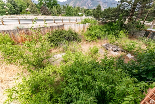 5841 S Fontaine Bleu Dr E, Murray, UT 84121 - view of yard featuring a mountain view