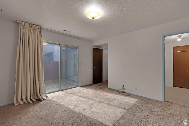 597 W Brookshire Dr, Ogden, UT 84405 - carpeted empty room featuring a textured ceiling