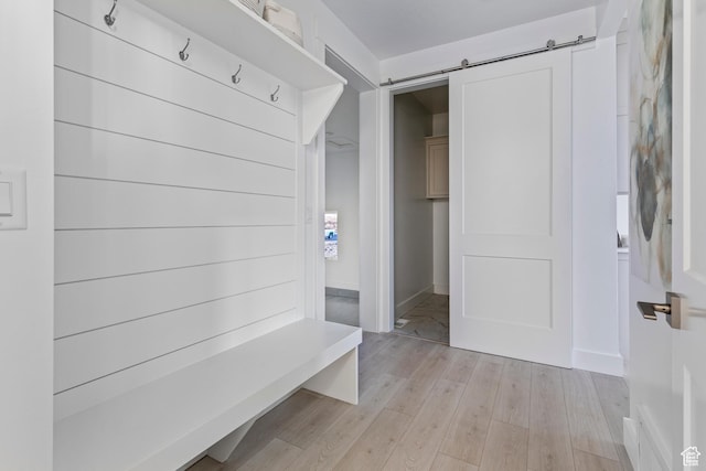 168 N 870 E Unit 22, Tremonton, UT 84337 - mudroom featuring light wood-type flooring and a barn door
