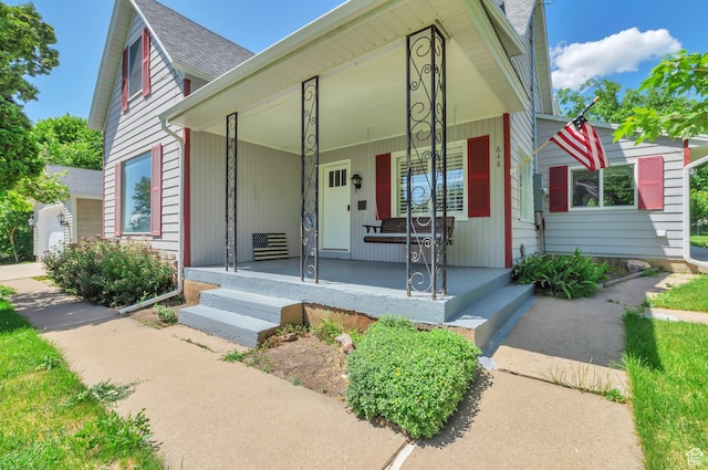 648 E 2550 N, North Ogden, UT 84414 - view of front of home with a porch and roof with shingles