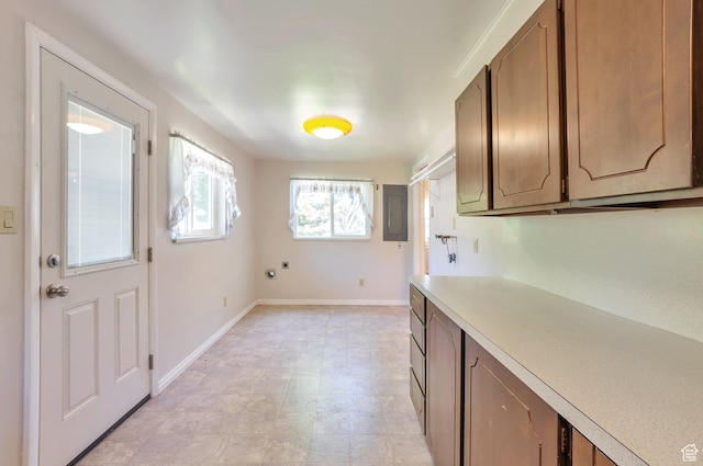 648 E 2550 N, North Ogden, UT 84414 - kitchen featuring light countertops, electric panel, and brown cabinets