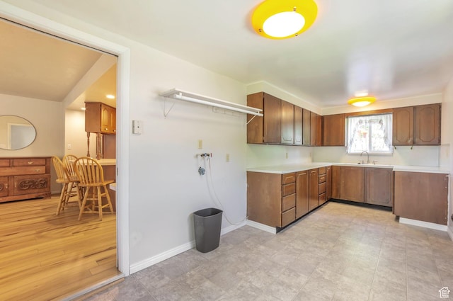 648 E 2550 N, North Ogden, UT 84414 - kitchen with light countertops and brown cabinetry