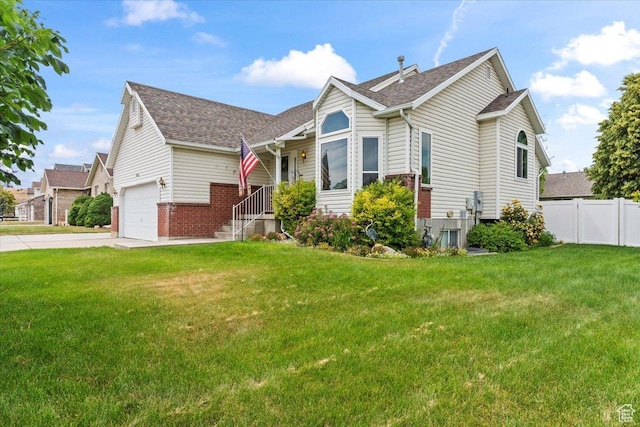 1014 W 4150 S, Riverdale, UT 84405 - view of front of home with driveway, a shingled roof, and brick siding