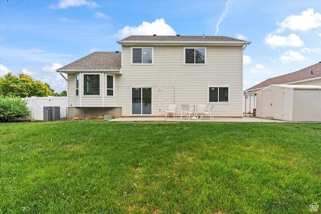1014 W 4150 S, Riverdale, UT 84405 - back of house with a storage shed, a patio, and roof with shingles