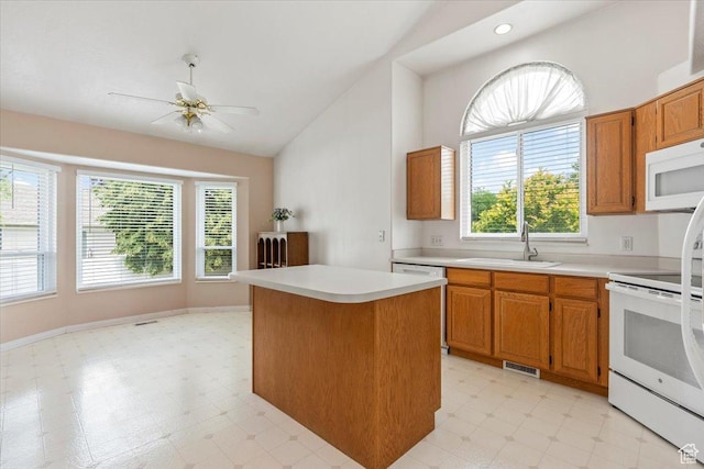 1014 W 4150 S, Riverdale, UT 84405 - kitchen featuring white appliances, light countertops, light flooring, a ceiling fan, and high vaulted ceiling