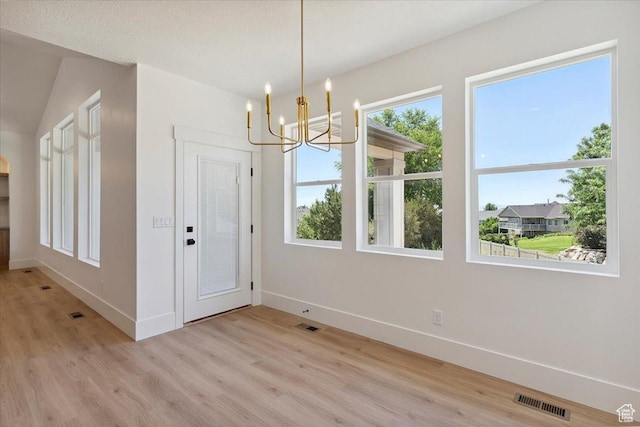 4095 N 100 E, North Ogden, UT 84414 - unfurnished dining area featuring a chandelier and light wood-style flooring