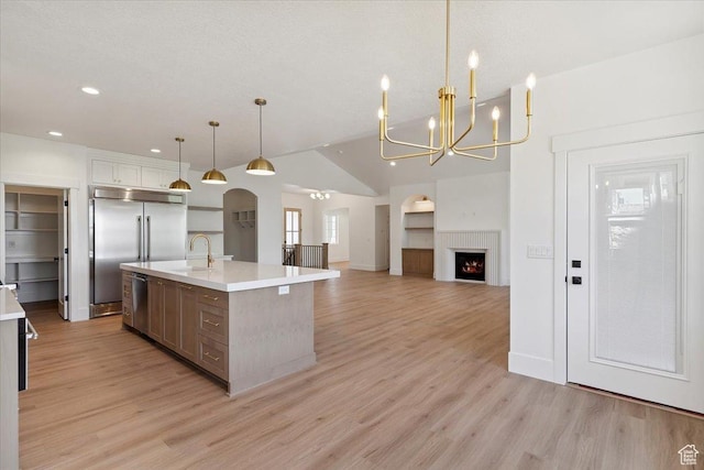 4095 N 100 E, North Ogden, UT 84414 - kitchen with appliances with stainless steel finishes, light countertops, a chandelier, light wood-style flooring, and recessed lighting