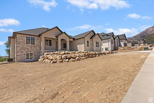 4095 N 100 E, North Ogden, UT 84414 - french country home with stone siding and a mountain view