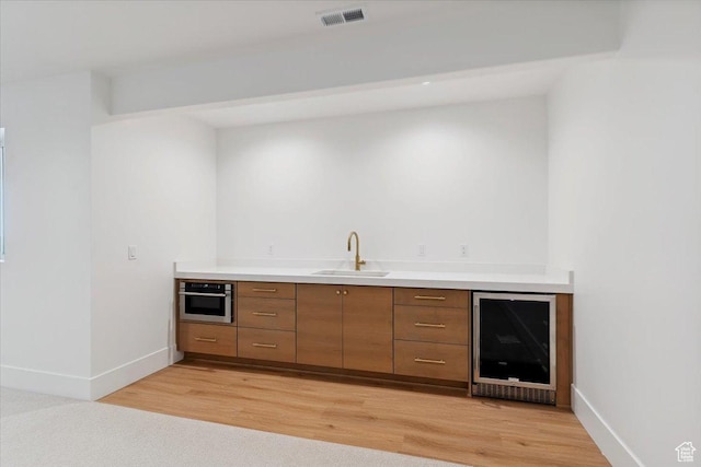 4095 N 100 E, North Ogden, UT 84414 - indoor wet bar with wine cooler, light wood-type flooring, and oven