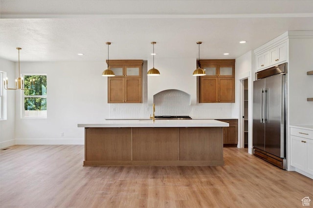 4095 N 100 E, North Ogden, UT 84414 - kitchen featuring built in refrigerator, light wood-style floors, light countertops, and recessed lighting
