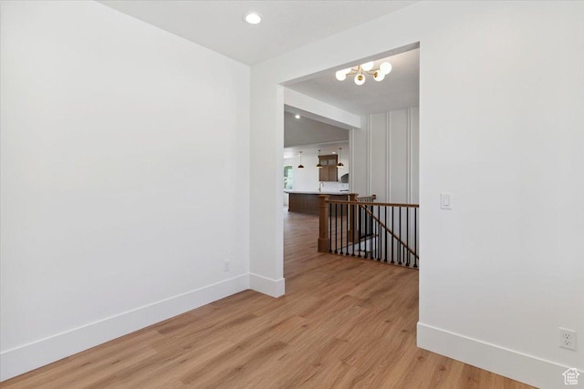 4095 N 100 E, North Ogden, UT 84414 - unfurnished room with light wood-style flooring, a chandelier, and recessed lighting