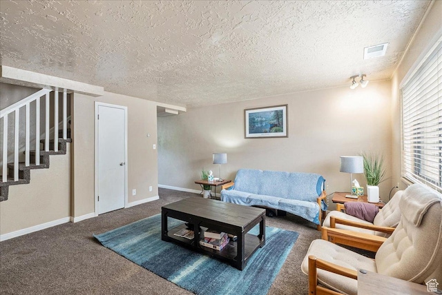 1454 Lancelot Dr, Provo, UT 84601 - carpeted living area featuring stairs and a textured ceiling