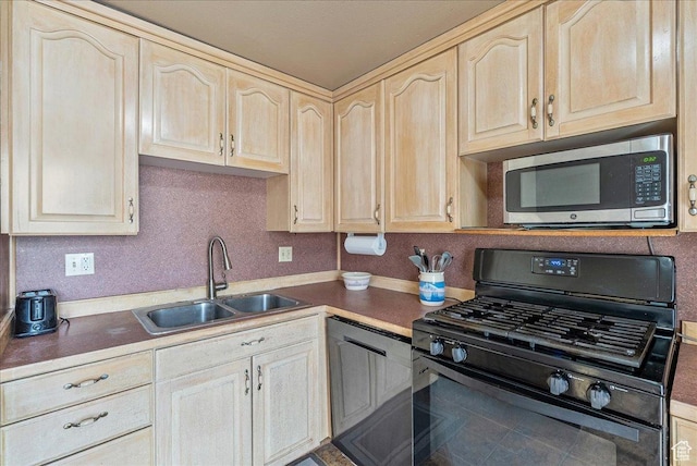 1454 Lancelot Dr, Provo, UT 84601 - kitchen with black gas range oven, stainless steel microwave, and light brown cabinets