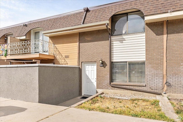 1454 Lancelot Dr, Provo, UT 84601 - property entrance with brick siding and mansard roof