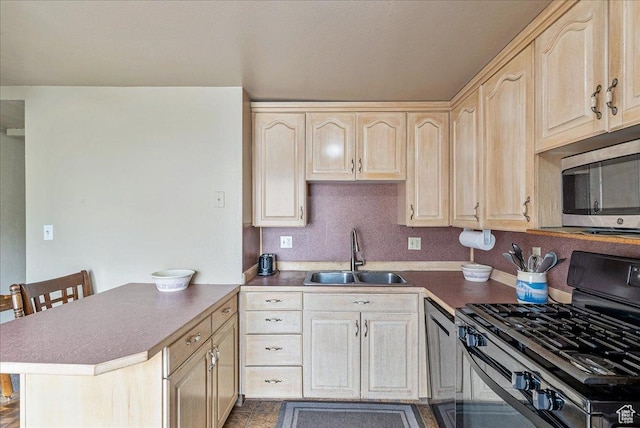 1454 Lancelot Dr, Provo, UT 84601 - kitchen featuring stainless steel microwave, range with gas cooktop, light brown cabinetry, and a peninsula