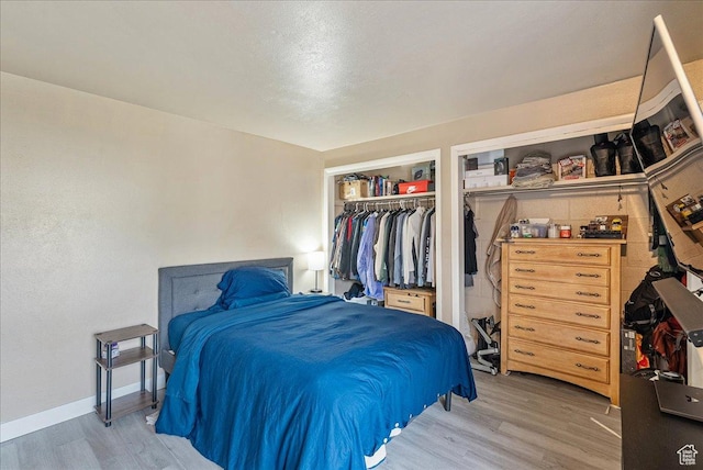 1454 Lancelot Dr, Provo, UT 84601 - bedroom with light wood-style floors and a closet