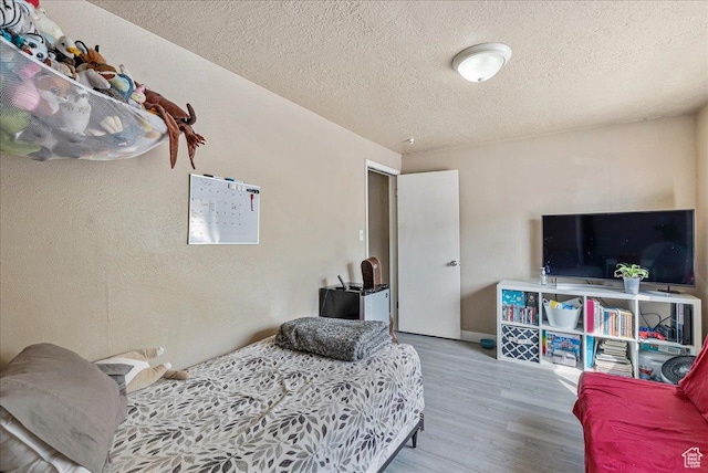 1454 Lancelot Dr, Provo, UT 84601 - bedroom featuring wood finished floors and a textured ceiling