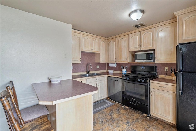 1454 Lancelot Dr, Provo, UT 84601 - kitchen featuring black appliances, light brown cabinets, a peninsula, and a kitchen bar