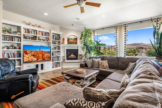 93 E 700 N, La Verkin, UT 84745 - living area featuring a ceiling fan, recessed lighting, a glass covered fireplace, and wood finished floors