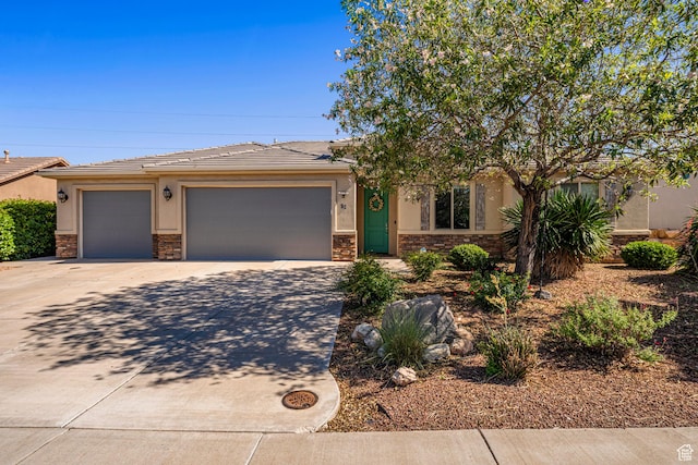 93 E 700 N, La Verkin, UT 84745 - view of front of home with stone siding, stucco siding, and driveway