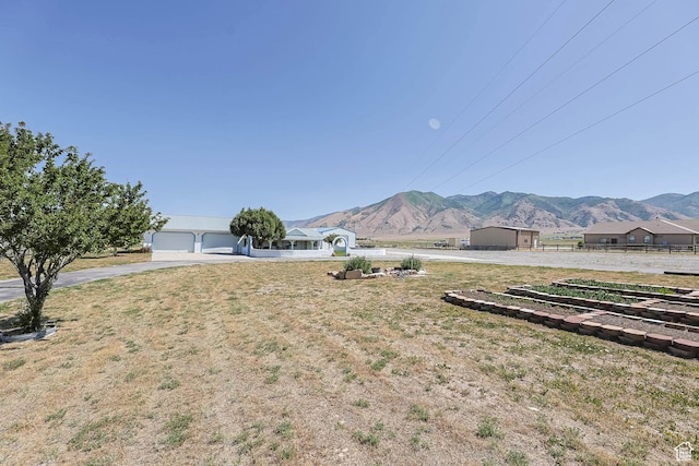 1309 Pine Canyon Rd, Tooele, UT 84074 - view of yard featuring a mountain view and concrete driveway