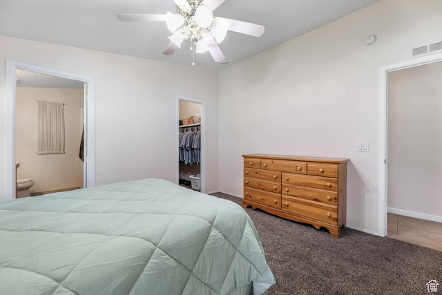 1309 Pine Canyon Rd, Tooele, UT 84074 - carpeted bedroom featuring a spacious closet, a closet, connected bathroom, and ceiling fan