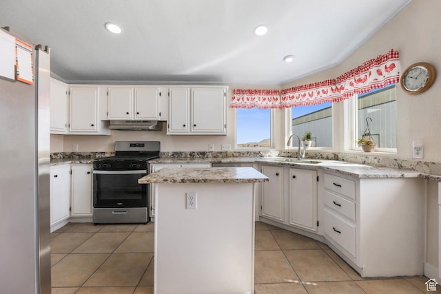 1309 Pine Canyon Rd, Tooele, UT 84074 - kitchen featuring stainless steel appliances, under cabinet range hood, white cabinetry, light tile patterned floors, and recessed lighting