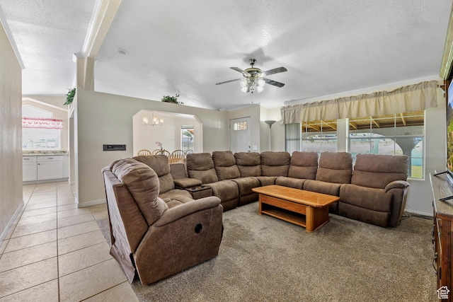 1309 Pine Canyon Rd, Tooele, UT 84074 - living area featuring ceiling fan, a chandelier, a textured ceiling, and light tile patterned flooring
