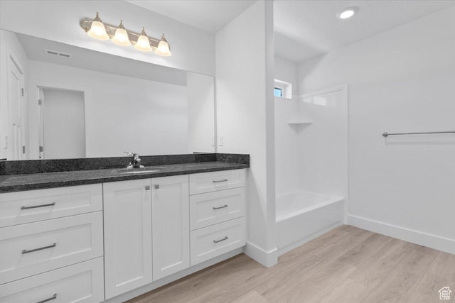 221 W 815 N Unit 21, Nephi, UT 84648 - full bathroom with wood finished floors, vanity, bathtub / shower combination, and recessed lighting