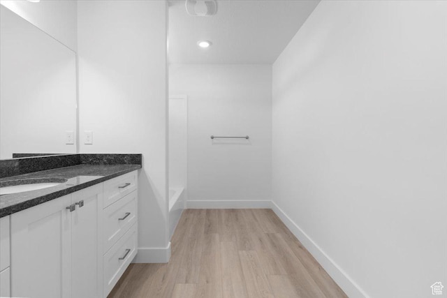221 W 815 N Unit 21, Nephi, UT 84648 - bathroom with vanity, wood finished floors, and a tub to relax in