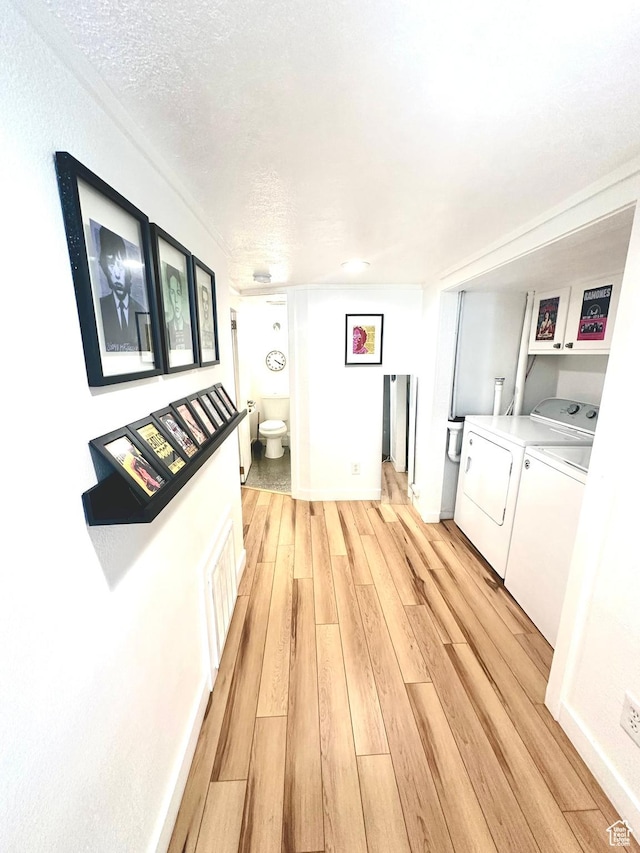 22 W 300 N, Salt Lake City, UT 84103 - hall with washer and dryer, light wood-style flooring, and a textured ceiling