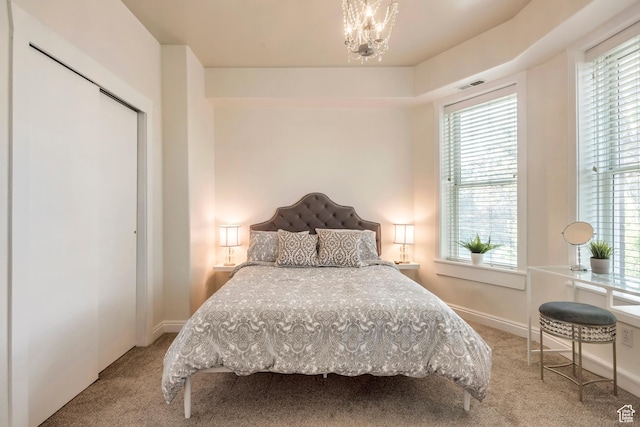 22 W 300 N, Salt Lake City, UT 84103 - bedroom with carpet flooring, a chandelier, multiple windows, and a closet