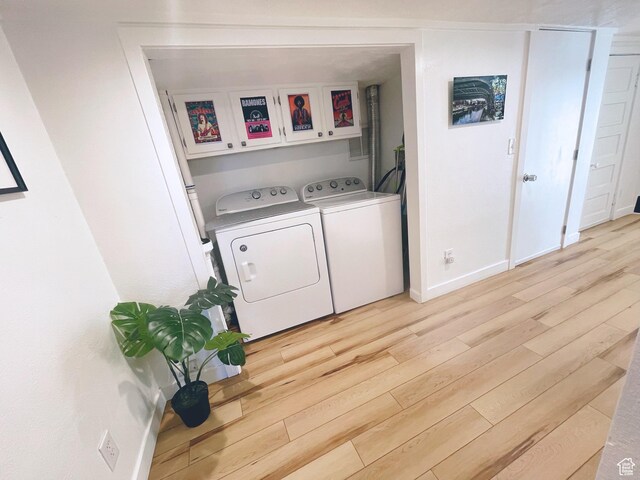 22 W 300 N, Salt Lake City, UT 84103 - washroom with washer and clothes dryer, cabinet space, and light wood-style flooring