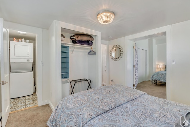 22 W 300 N, Salt Lake City, UT 84103 - carpeted bedroom with stacked washer and clothes dryer and a closet