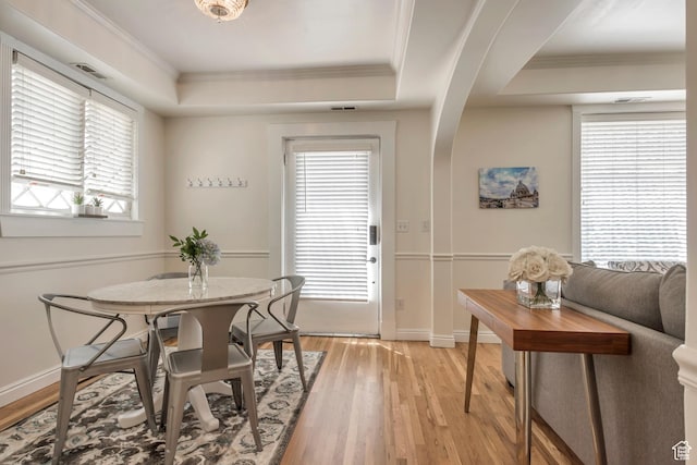 22 W 300 N, Salt Lake City, UT 84103 - dining area featuring a tray ceiling, light wood finished floors, plenty of natural light, and crown molding