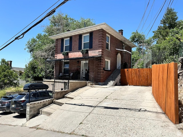 22 W 300 N, Salt Lake City, UT 84103 - view of front of property with brick siding and a chimney