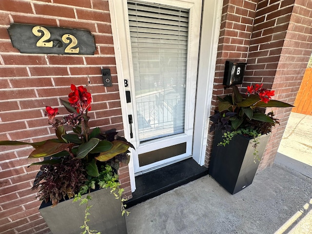 22 W 300 N, Salt Lake City, UT 84103 - doorway to property featuring brick siding