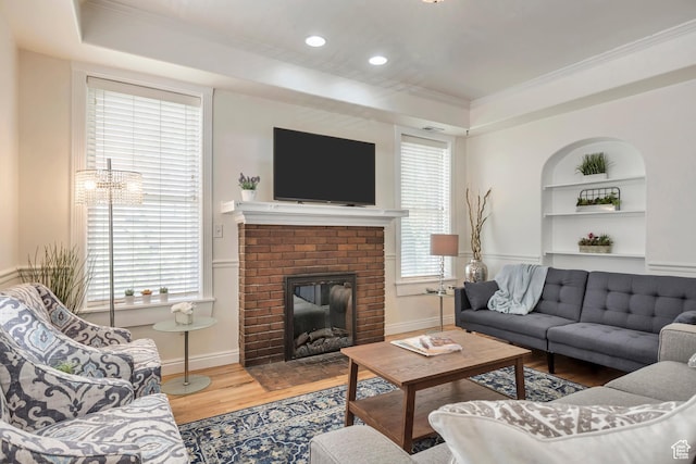 22 W 300 N, Salt Lake City, UT 84103 - living area with a raised ceiling, crown molding, wood finished floors, a brick fireplace, and built in shelves