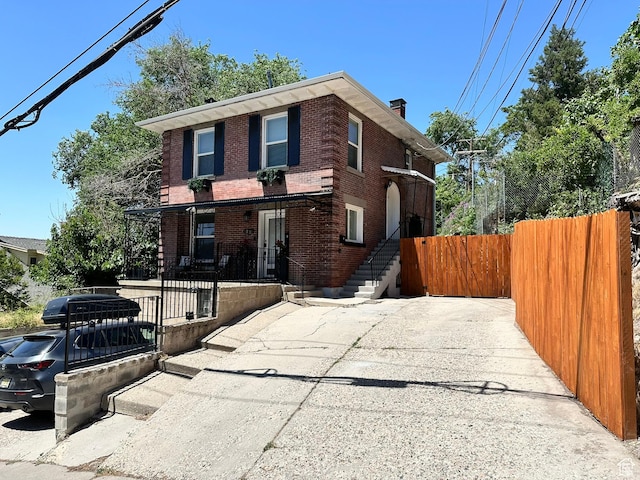 22 W 300 N, Salt Lake City, UT 84103 - view of front facade featuring brick siding and a chimney