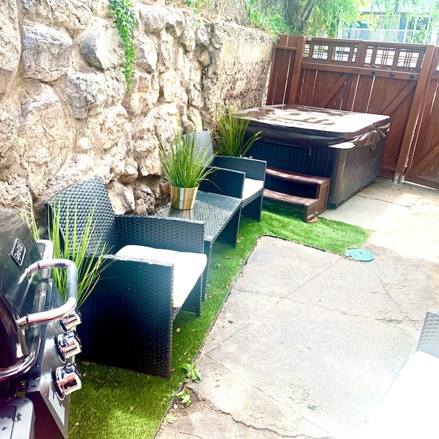 22 W 300 N, Salt Lake City, UT 84103 - view of patio with a hot tub and a gate