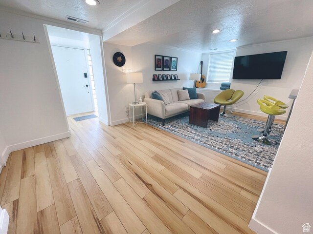 22 W 300 N, Salt Lake City, UT 84103 - living area with wood finished floors, a textured ceiling, and recessed lighting
