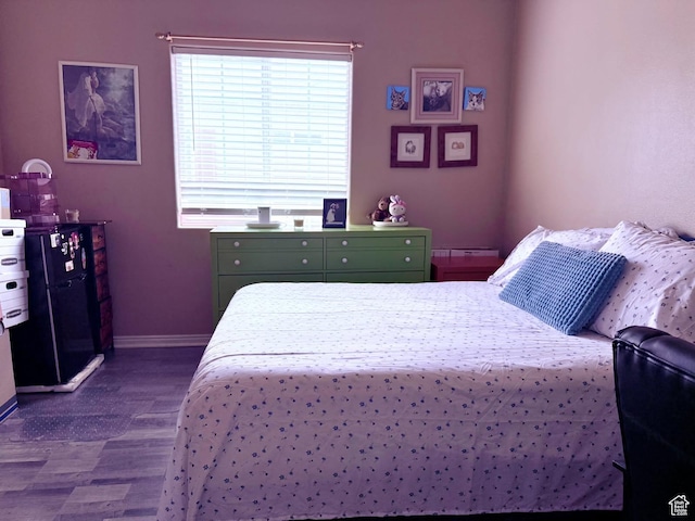 3827 S Big River Way W Unit 3, South Salt Lake, UT 84119 - bedroom featuring dark wood-style floors and baseboards