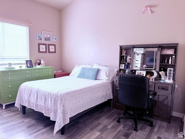 3827 S Big River Way W Unit 3, South Salt Lake, UT 84119 - bedroom with wood finished floors and an office area