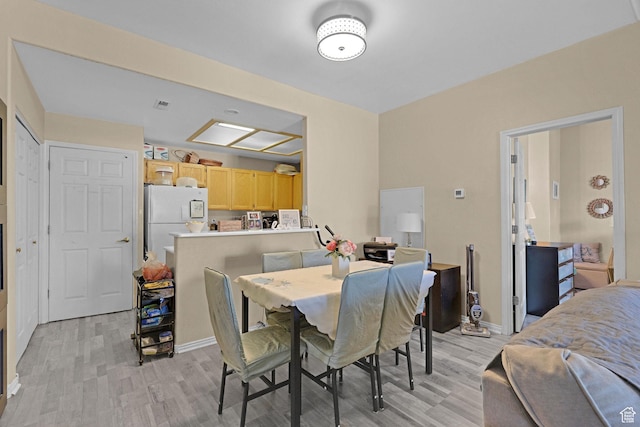 3827 S Big River Way W Unit 3, South Salt Lake, UT 84119 - dining space featuring light wood-style flooring and baseboards