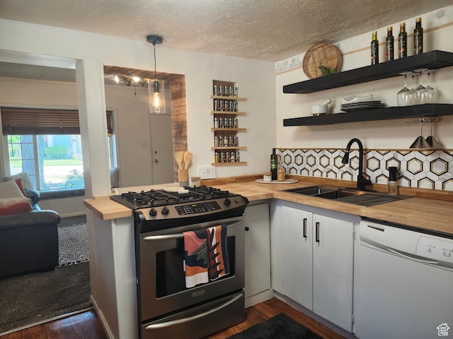 280 E Franklin St S, Ogden, UT 84401 - kitchen with dishwasher, butcher block counters, stainless steel gas range oven, open shelves, and dark wood-style floors